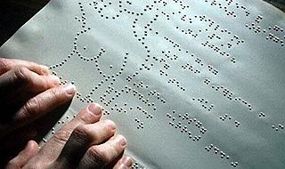Braille is read using two hands. Is it incompatible with porn?